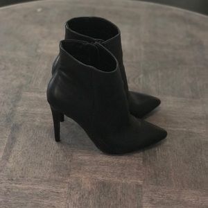 Black pointed toe heeled boots